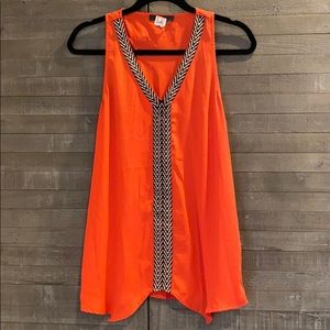 Reddish orange flow tank top with v neckline